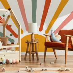 a child's room with colorful wallpaper and wooden toys on the floor in front of it