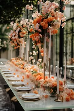 a long table with flowers and candles on it