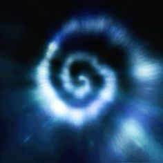 a blurry image of a spiral in the dark blue sky with light coming from it