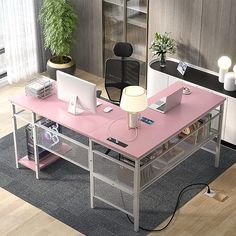 an office desk with two laptops on it and a lamp in the corner next to it