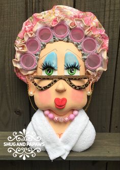 a close up of a doll with glasses on it's face