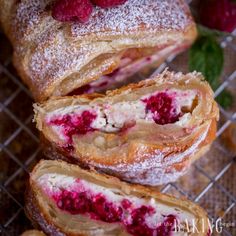 raspberry filled pastries on a cooling rack