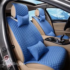 the interior of a car with blue quilting and tan leather seats in front of it