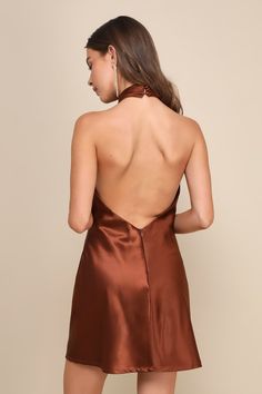 The Lulus Beyond Classy Brown Satin Halter Mini Dress is perfect for a night of bubbly and dancing! Sleek woven satin shapes this chic dress that has a halter neckline (with button closures) and a crisscrossing bodice. The column silhouette continues down to a mini hem with a thigh-high slit at the front. Hidden back zipper/clasp. Fit: This garment fits true to size. Length: Mid-thigh. Size medium measures 23.5" from top to bottom. Bust: Great for any cup size. Waist: Loosely Fitted. Hip: Loosel Brown Homecoming Dresses, Brown Short Dress, Brown Halter Dress, Short Brown Dress, Short Satin Dress, Satin Halter Dress, Casual Wedding Guest Dresses, Brown Mini Dress, Womens Trendy Dresses