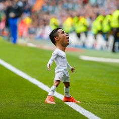 a man standing on top of a soccer field