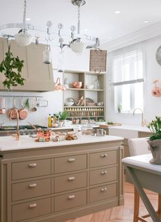 a kitchen filled with lots of counter top space next to a dining room table and chairs