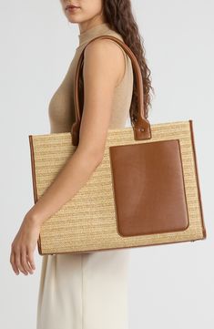 Faux-leather seams and a contrast pocket reinforce a woven straw tote bag featuring a spacious interior and removable zip pouch. Two top handles Interior has wall zip pocket and removable zip pouch Lined Straw/synthetic Imported Straw Tote Bag, Straw Tote, Zip Pouch, Zip Pockets, Straw, Faux Leather, Pouch, Nordstrom