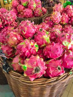 baskets filled with dragon fruit sitting on top of a tiled floor