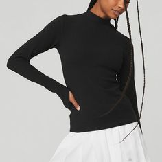 Wellness Rib Mock Neck Long Sleeve - Black | Alo Yoga Casual Second-skin Long Sleeve Tops, Sleek Turtleneck Tops With Thumbholes, Chic Alo Yoga Tops For Spring, Alo Yoga Long Sleeve Top, Casual Ribbed Alo Yoga Tops, Sleek Tops With Minimal Stretch For Fall, Sleek Tops For Fall With Minimal Stretch, Sleek Fall Tops With Minimal Stretch, Sleek Black Mock Neck Top For Fall