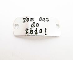 "Need a little motivation when you run, exercise or play your favorite sport? As you'll read on your shoe: \"You can do this!\" I can also hand stamp a custom phrase if you prefer, no extra fee! This silver aluminum tag is for you to add to your shoe laces to keep you going. I ran in this daily and I can attest that it does not flop around; you won't even know it's there but it does add a little bit of reflective material to your ensemble! This listing is for one shoe tag,  if you need two or mo Stamped Necklaces, Metal Stamped Jewelry, Personalized Shoes, Hand Stamped Necklace, Team Board, Shoe Tags, Reflective Material, Personalized Tags, Shoe Clips