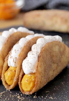 pumpkin pie tacos with whipped cream on top and oranges in the background text reads pumpkin pie tacos