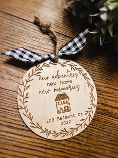 a wooden ornament that says new adventures, new home and memories on it