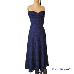 Lovely 1940s cocktail dress in dark navy blue lace over satin taffeta. Strapless boned bodice, side zip, gored skirt. The matching jacket has small shoulder pads and a button/loop closure. The buttons are round glass with small rhinestone inset in the center. Winged cuffs.  None missing.  Excellent condition. Though there was likely once a belt, considering the thread loops, I don't seem to have it. I will look once more before packaging.   Measurements are taken outside of the garment while fla Navy Blue Lace Dress, Gored Skirt, Blue Lace Dress, Boned Bodice, Cutout Maxi Dress, Style Finder, Lace Blue Dress, Maxi Dress Cocktail, Strapless Maxi Dress