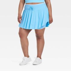 Why we're ALL IN: Solid-color seamless skort with soft gathers and wrap-style accents on the sides. Boasts a midweight nylon and spandex construction with four-way stretch as well as moisture-wicking properties to help keep you cool and comfy during any activity. The wide waistband with drawcord, built-in brief, mini length and mid-rise waist complete the sporty design. All in Motion™: Inspiring the potential in every body. Sporty Stretch Blue Swim Skirt, Blue Stretch Swim Skirt For Sports, Blue Stretch Nylon Swim Skirt, Blue 4-way Stretch Athleisure Skort, Blue 4-way Stretch Sporty Skort, Sporty Blue Swim Skirt With 4-way Stretch, Sporty Blue 4-way Stretch Swim Skirt, Blue Moisture-wicking Swim Skirt For Sports, Sporty Blue Moisture-wicking Swim Skirt