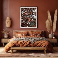 a bed with orange sheets and pillows in a bedroom next to a painting on the wall