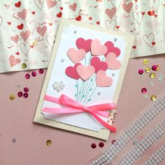 valentine's day card with pink flowers and hearts on it, surrounded by confetti