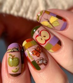 Embrace the beauty of fall with this charming nail art design featuring apples, butterflies, and colorful patchwork patterns. Perfect for the cozy autumn season. 🍂🍎🦋 #FallNails #AutumnNailArt #NailArtIdeas #PatchworkNails #AppleNailArt #ButterflyNailArt #NailInspo #ManicureIdeas #AugustNails #NailArtDesigns #NailArtTutorial #DIYNails #NailArtGoals #NailArtInspiration #NailArtAddict #NailArtLover Pretzel Nail Art, Gel Manicure Designs Fall, Apple Nail Art Fall, Apple Nails Art, Nail Art Bird, Fall Themed Nail Designs, Fall Apple Nails Design, The Very Hungry Caterpillar Nails, Funky Fall Nail Designs