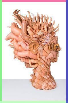 there is a sculpture made out of many different things in the shape of a human head