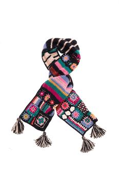 a multicolored knitted scarf with tassels