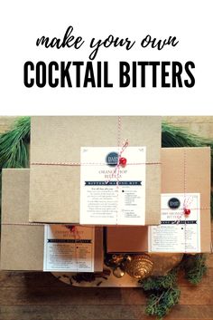 an open box with the words make your own cocktail bitterrs on it and pine cones