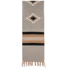 a gray and brown blanket with fringes