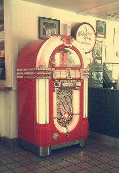 an old fashioned red and white juke box