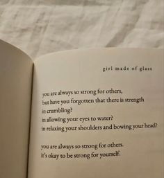 an open book with the words girl made of glass written in cursive writing