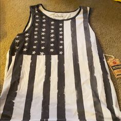 American Flag Tank Top Never Worn With Tags. Size M Casual American Flag Print Tank Top For Spring, Spring Casual Tank Top With American Flag Print, White Sleeveless Top With Flag Print, Cotton Tank Top With Flag Print For Spring, Casual White Tank Top With Flag Print, White American Style Top For Spring, White American Flag Print Tank Top For Spring, White Tank Top With American Flag Print For Spring, Spring White Tank Top With American Flag Print