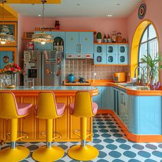 a kitchen with blue cabinets and yellow stools next to a counter top that has three chairs on it