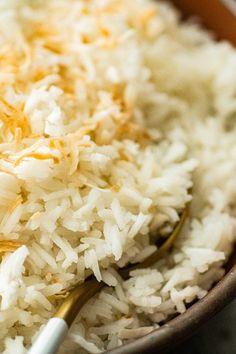 white rice in a bowl with a spoon