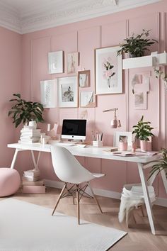 a home office with pink walls and white furniture