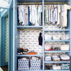 an organized closet with blue shelves and drawers