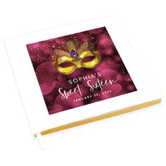 a personalized photo album with a masquerade mask on the cover and name