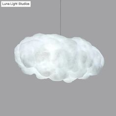 a white light that is hanging from a ceiling fixture with the words luna light studios above it