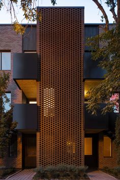 the facade of an apartment building is made out of bricks