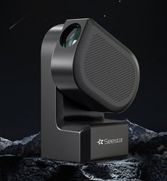 an image of a projector that is on top of a mountain in the night