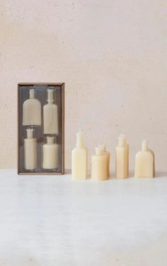 boxed set of vintage bottle shaped candles with unboxed bottle shaped candles arranged next to the box. Serum Bottle, Bottle Shapes, Cozy Candle, Shaped Candles, Bottle Candles, Vintage Bottle, Creative Co Op, Candle Shapes, Vintage Inspired Design