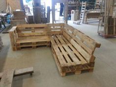 several pieces of wood sitting on the floor next to each other in a room filled with pallets