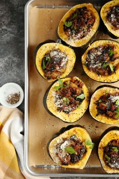 baked stuffed acorns with meat and cheese on a baking sheet, ready to be eaten