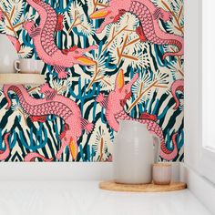 pink flamingos and palm leaves wallpaper in a white room with an open window