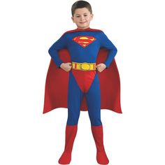 a boy in a superman costume standing with his hands on his hips