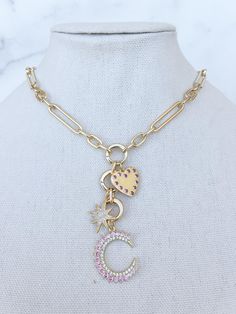 This gold filled charm necklace will be your every day staple! Detailed with beautiful pink and clear stone charms (that are removable) and closed with a large lobster clasp that can adjust on different lengths of the chain!  We offer this piece in various colors: * pink * light blue * dark blue Necklace Gold Chain, Heart Charm Necklace, Gold Filled Necklace, Necklace Chunky, Gold Charm Necklace, Clear Stone, Chunky Necklace, Pink Light, Gold Chain Necklace