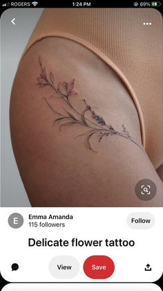 the back of a woman's thigh with flowers on it and text below that reads, delicate flower tattoo