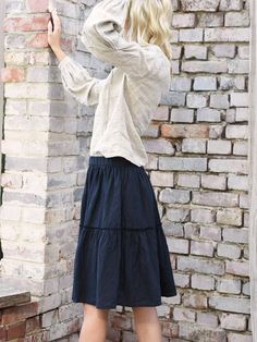 "Linen skirt with delicate, decorative wild edge on the frills. Relaxed fit with mid waist. Gorgeous, elegant and natural. The simple cut, perfect for any figure. Pair with our linen tops. French seems DETAILS: - 100% washed, softened, light  linen.  - Includes one linen skirt - The images above show the 'navy blue' colour - Wide waistband ensures comfort - Pockets on the sides - Shrinkage after the first wash up to 3% - Does not cause allergies - Has bacteriostatic properties - Is ecological an Modest Relaxed Tiered Skirt, Modest Tiered Skirt, Modest Tiered Skirt With Elastic Waistband, Relaxed Fit Lined Tiered Skirt, Relaxed Fit Tiered Maxi Skirt With Lining, Casual Long Skirt With Ruffle Hem, Flowy Midi Skirt With Ruffle Hem, Beige Voluminous Tiered Skirt, Casual Ruffled Voluminous Maxi Skirt