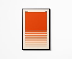 an orange and white poster hanging on the wall