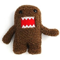 a brown stuffed animal with red teeth on it's face