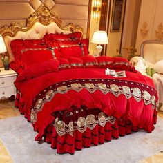 a red bed with gold trimmings in a luxurious bedroom or living room area