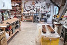 a room filled with lots of tools and workbenches