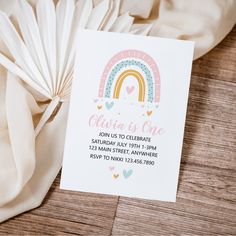 a card with a rainbow and hearts on it next to some white tissue paper that says china is one