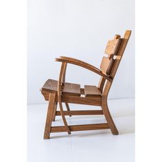 a wooden chair sitting on top of a white floor